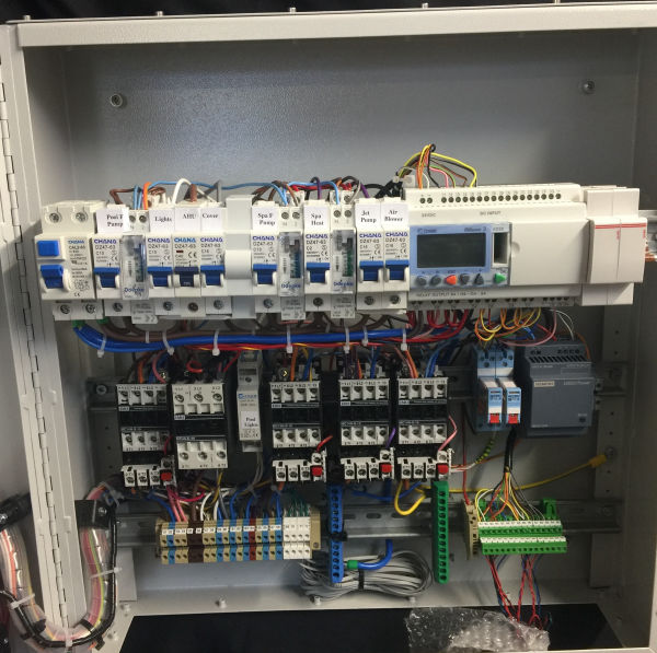 Swimming pool and spa control panels in enclosure
